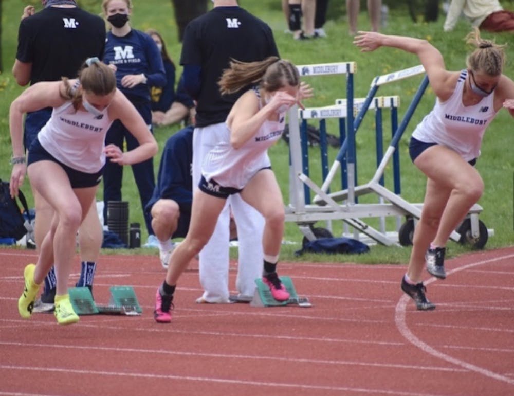 Charlie Keohane ’24 (center), a walk-on on the women’s track and field team, sprints out of the blocks in a 100-meter dash.