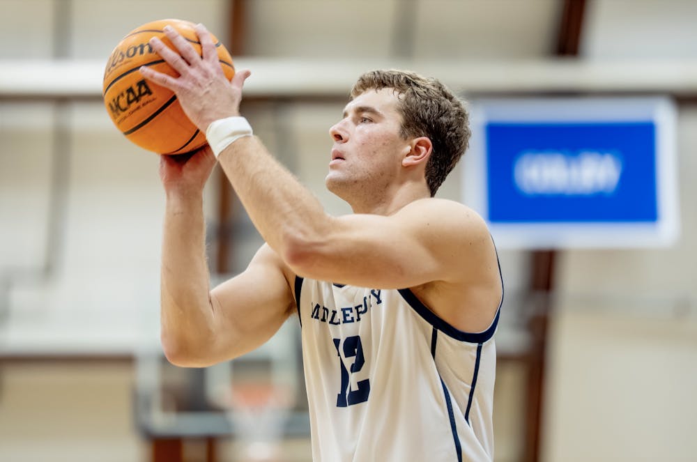 Senior Edward Witherington '26 made two three-point shots in Middlebury's game against Trinity last Friday.