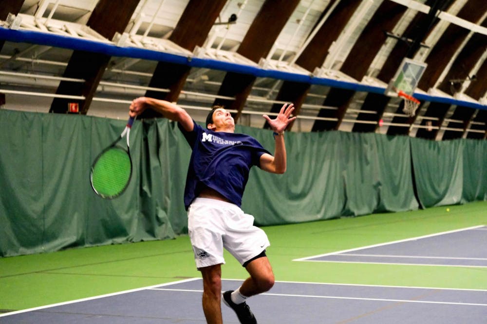 <span class="photocreditinline">Shirley Mao</span><br />Captain Lubomir Cuba ’19 fires off a serve at the Nelson Recreation Arena.