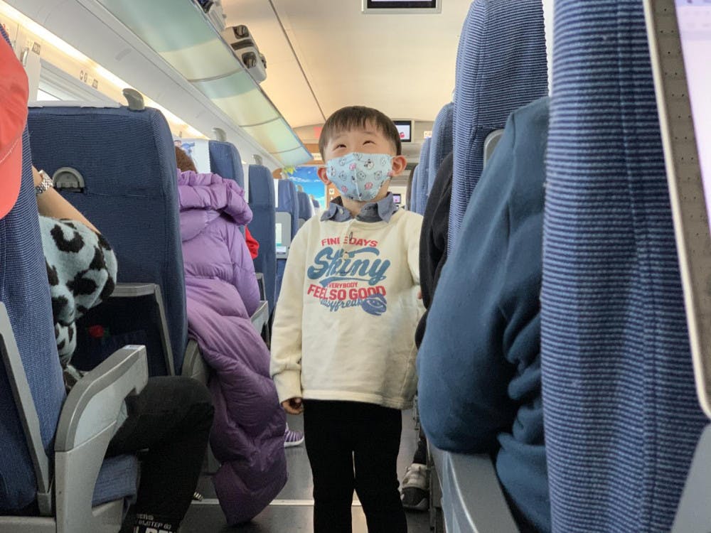 <span class="photocreditinline"><a href="https://middleburycampus.com/staff_profile/benjy-renton/">BENJY RENTON</a></span><br />A child wears a mask on a Chinese train from Beijing to Harbin on January 25. The recent outbreak of the coronavirus in China has caused Middlebury to suspend its spring semester programs in China and order the return of all students who were studying in China back to the U.S.