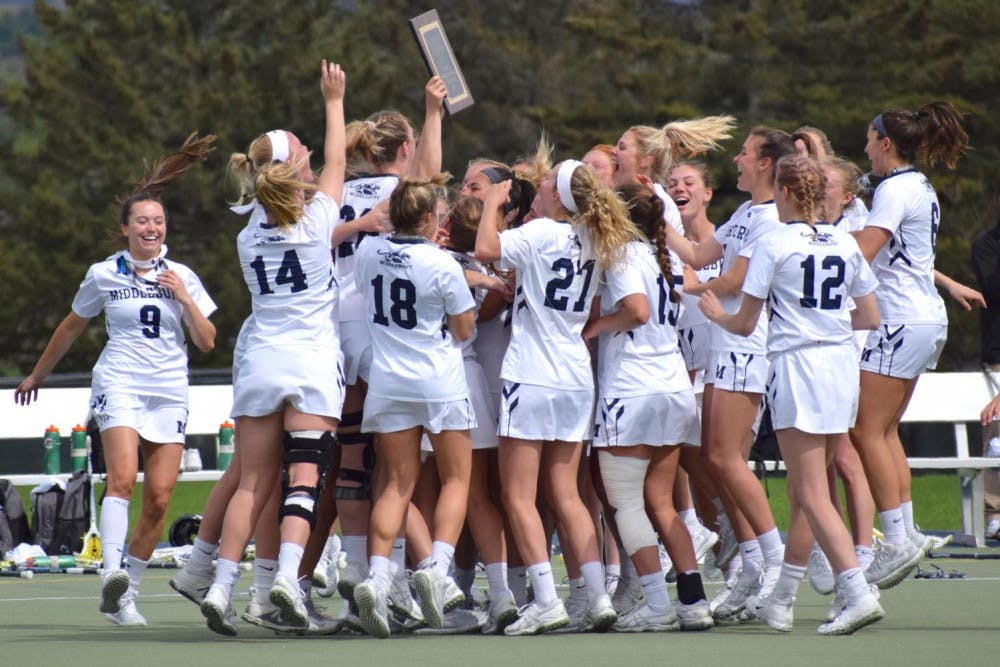 <span class="photocreditinline"><a href="https://middleburycampus.com/39367/uncategorized/benjy-renton/">BENJY RENTON</a></span><br />The women's lacrosse team celebrates after narrowly defeating Tufts 10-9 in the NESCAC Championship. The team has now captured its seventh national title in program history.