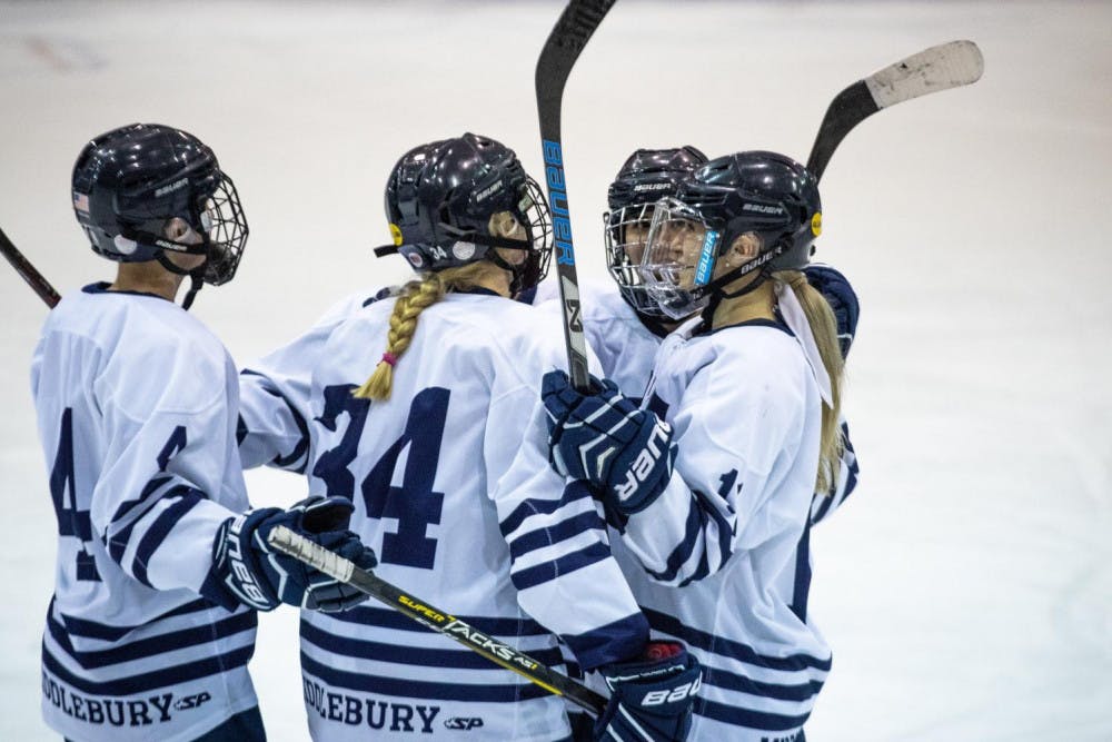 <span class="photocreditinline">MICHAEL BORENSTEIN/THE MIDDLEBURY CAMPUS</span><br />The women’s hockey team celebrates after Anna Zumwinkle ’20 scores a goal against UMass Boston.