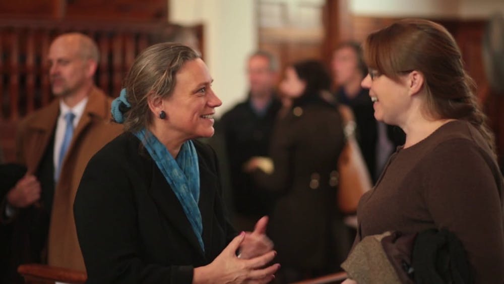 Laurie Patton speaks to a community member at the announcement of her presidency on Nov. 18, 2014.