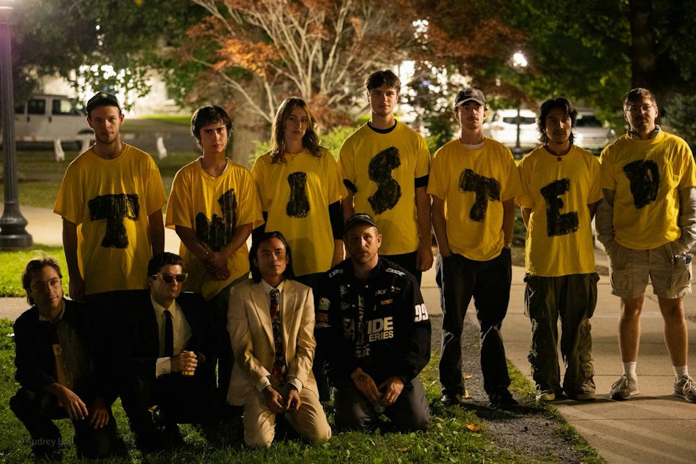 Eager concertgoers pose with Twisted Teens in their twisted tees.