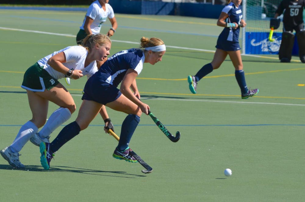 <span class="photocreditinline"><a href="https://middleburycampus.com/39367/uncategorized/benjy-renton/">BENJY RENTON</a></span><br />Molly Freeman ’19 fights for the ball from a Babson player on Sept. 23. Freeman scored the first goal against Skidmore on Sept. 26.