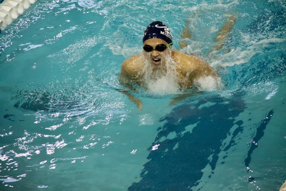 <span class="photocreditinline">SHIRLEY MAO</span><br />Cody Kim ’22 sprints to the finish during his 200 breaststroke race on Saturday, Dec. 1.