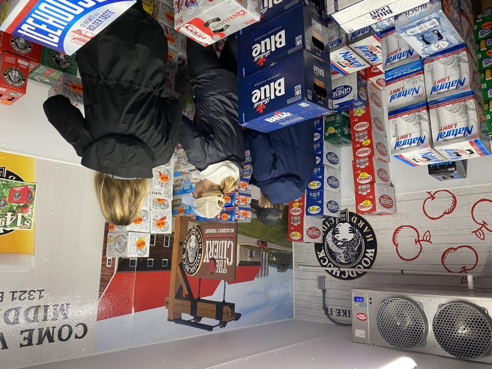 <span class="photocreditinline"><a href="https://middleburycampus.com/staff_profile/benjamin-glass/">BENJAMIN GLASS</a></span><br />Students stocked up on drinks at Middlebury Discount Beverage after receiving an announcement from the college that classes will be remote for the remainder of the semester. Students, especially seniors, have been planning parties before leaving campus indefinitely.