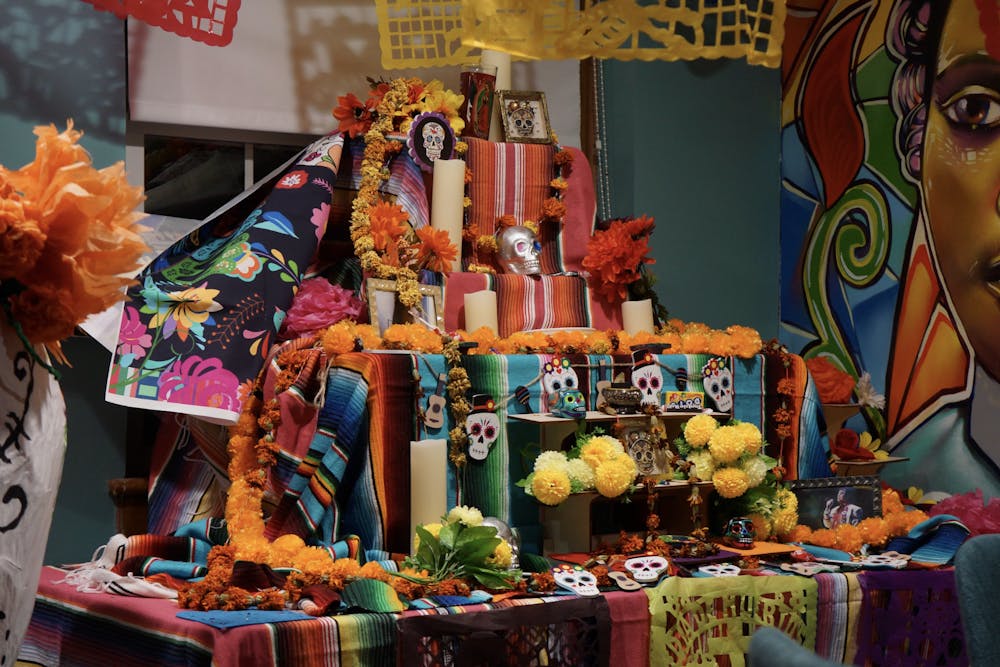 Ofrendas , altars with offerings for the dead, remember loved ones. Dancers performed baile folklórico, a mexican folk dance, in front of Proctor Dining Hall. 