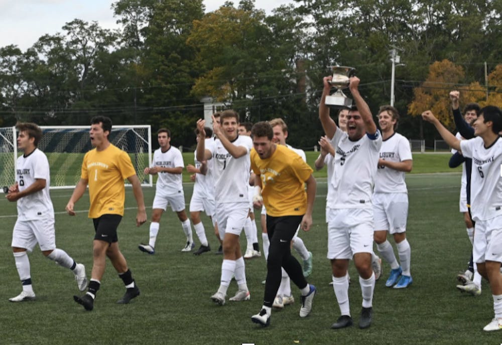 <p>Raffi Barsamian ’21.5, pictured with a trophy, celebrates a 3–0 win against Bates on Oct. 9.</p>