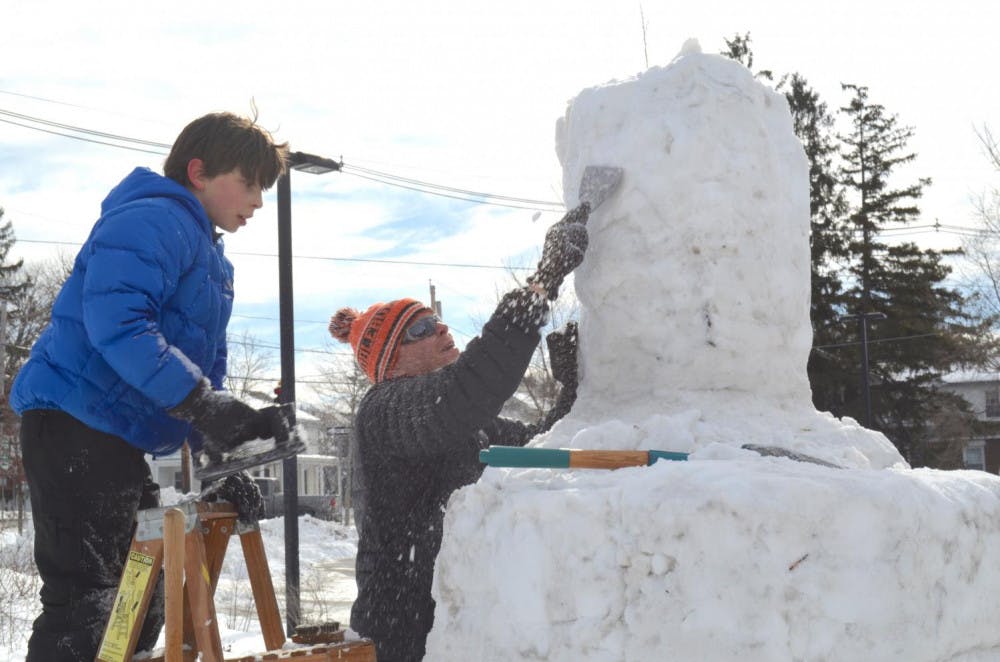 <span class="photocreditinline"><a href="https://middleburycampus.com/39367/uncategorized/benjy-renton/">BENJY RENTON</a></span><br />Geography professor Pete Nelson sculpts a snowy masterpiece.