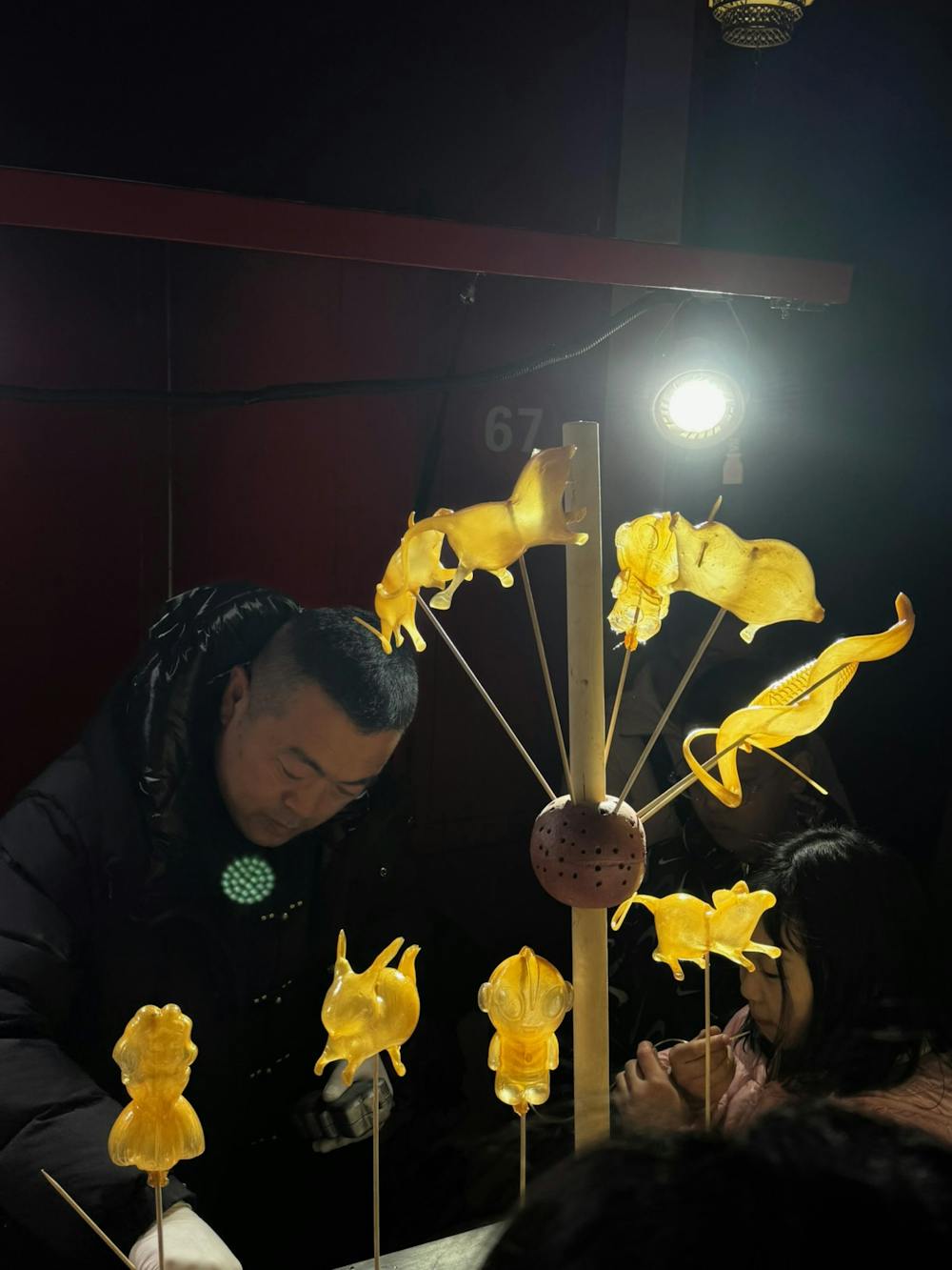 吹糖人 (chui tang ren): animal shaped candy formed after blowing into sugar at the Beijing lantern festival
