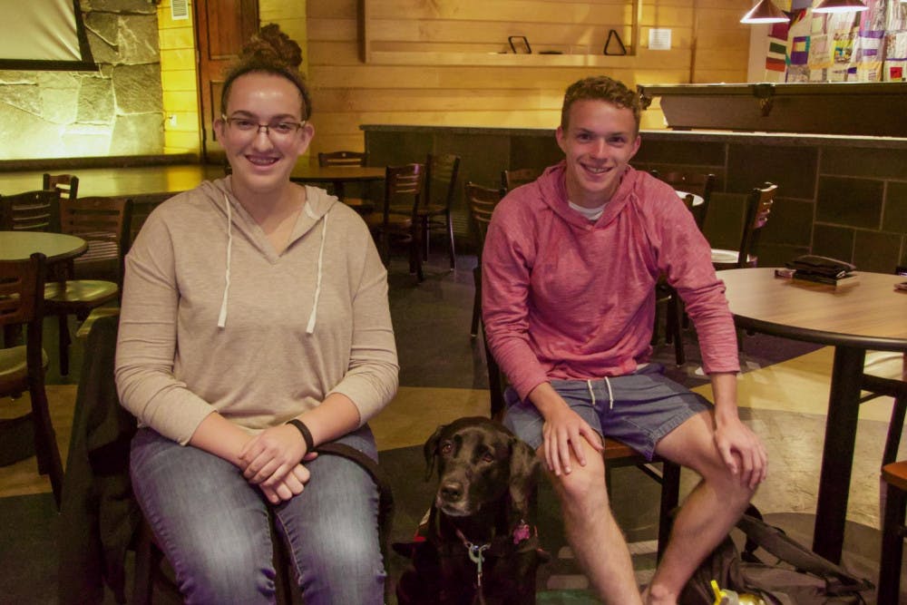 <span class="photocreditinline">VAN BARTH/THE MIDDLEBURY CAMPUS</span><br />Amy Conaway '20 (left) poses with her service dog and Graham Rainsby '21.