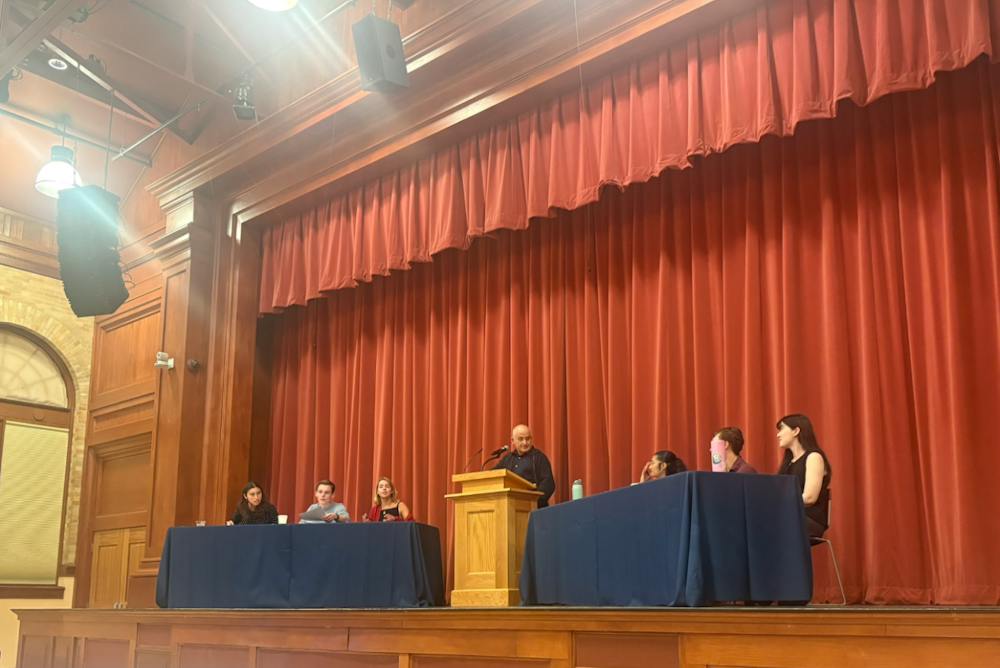 Students on the debate team discuss the meaning of academic freedom.