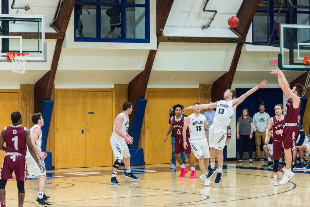 <span class="photocreditinline">AIDAN ACOSTA/THE MIDDLEBURY CAMPUS</span><br />Panther forward Matt Folger ’20 dribbles around the Bates perimeter. The Panthers defeated the Bobcats 82-76 last February.