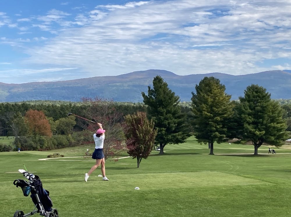 <p>Katie Murphy ’23 drives the ball from the first tee box at Ralph Myrhe Golf Course in Middlebury.</p>