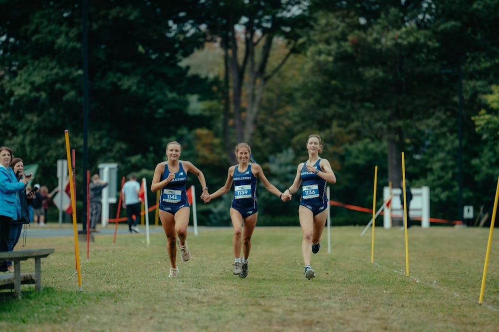 Middlebury’s Palmer ’29, MacLean ’27 and Jensen ’29 cross the finish line together