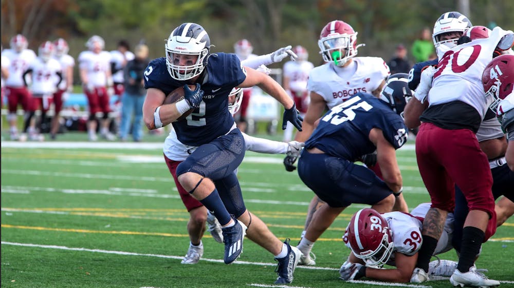 Connor McClellan ’28 driving up the field for Middlebury.