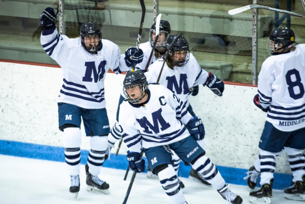 <span class="photocreditinline"><a href="https://middleburycampus.com/39670/uncategorized/michael-borenstein/">MICHAEL BORENSTEIN</a></span><br />The women's ice hockey team huddles after a win.