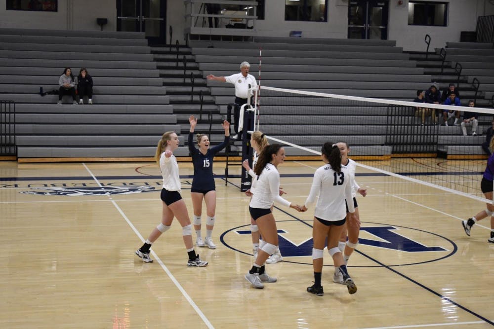 <span class="photocreditinline">MAX PADILLA/THE MIDDLEBURY CAMPUS</span><br />Gigi Alper ’20 celebrates with her teammates after winning a point against Saint Michael’s on Tuesday, Sept. 25. The team won against Connecticut College on Friday, Oct. 5 and lost to Wesleyan on Saturday, Oct. 6.