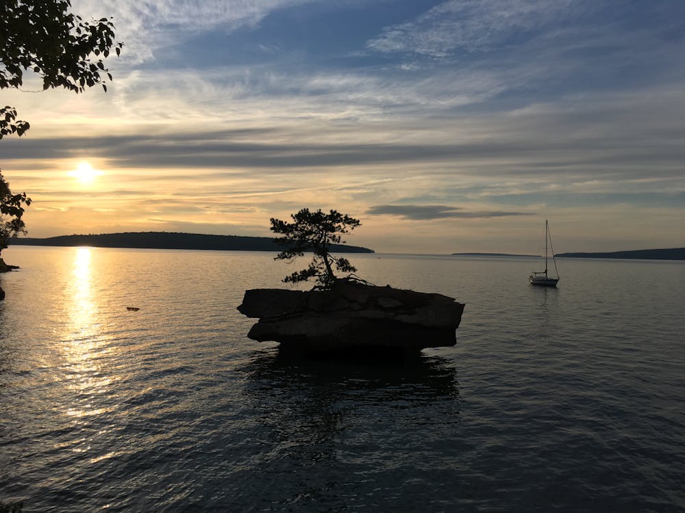 Honeymoon rock in northern Wisconsin, with Jordan’s sailboat in the background.