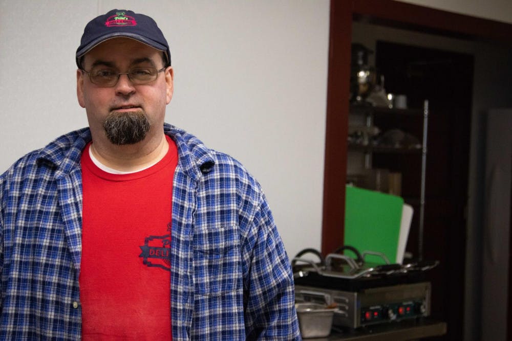 <span class="photocreditinline">Michael Borenstein/The Middlebury Campus</span><br />Former college employee Paul Dow in the kitchen at his newly opened BBQ joint.