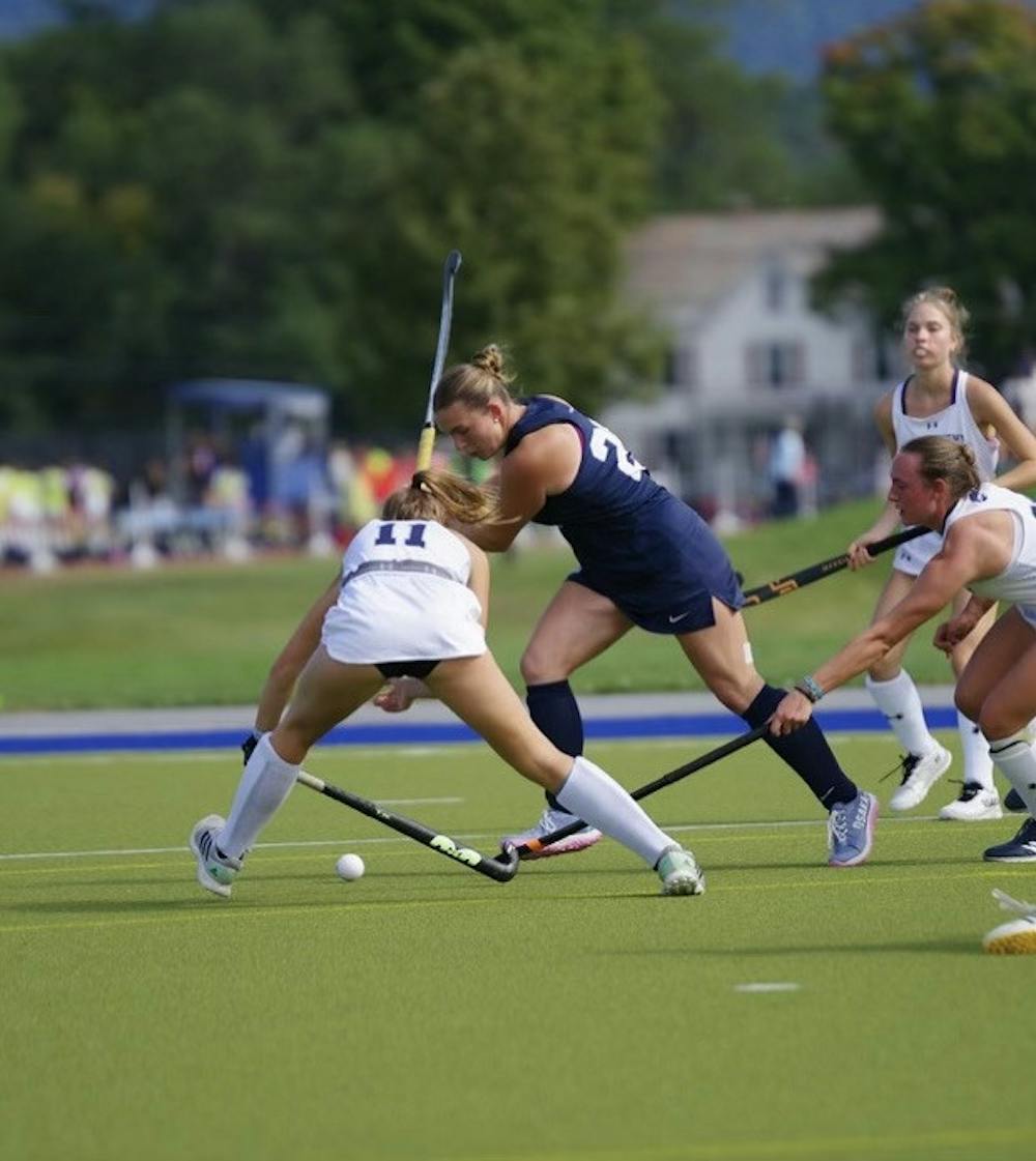 Madaket Rzepka ’26 weaves through opposing defenders.