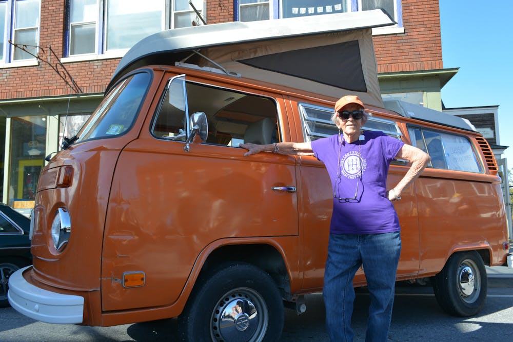 <p>Diane Mott poses with her 1973 Type 2 VW Bus</p>