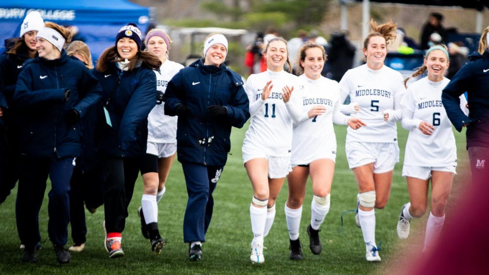<span class="photocreditinline"><a href="https://middleburycampus.com/39670/uncategorized/michael-borenstein/">MICHAEL BORENSTEIN</a></span><br />The women’s soccer team celebrates after advancing to the NCAA Final Four on Sunday, Nov. 18. This was the team’s second journey to the Final Four in program history and its first to the championship