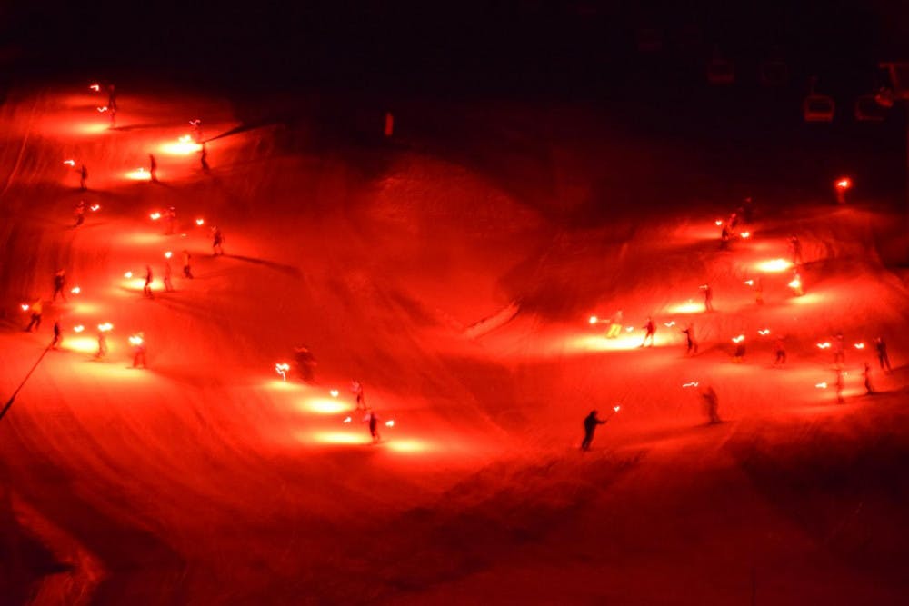 <span class="photocreditinline">BENJY RENTON/THE MIDDLEBURY CAMPUS</span><br />With a host of fire-laden torches, over 40 college ski patrol and ski instructors participated in a torchlight parade at the Snow Bowl to cap off February Orientation. Welcome, Middlebury Class of 2022.5!