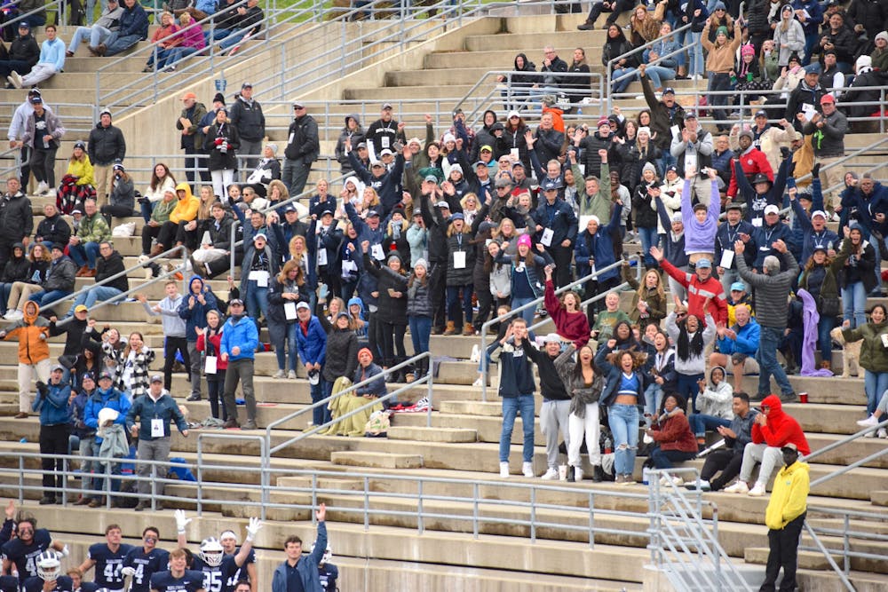 Middlebury football fans cheer on the team during their 42–35 win over Bowdoin on Saturday, Oct. 30. Men’s football was one of five varsity teams to win at home last weekend. (Courtesy of Benjy Renton)