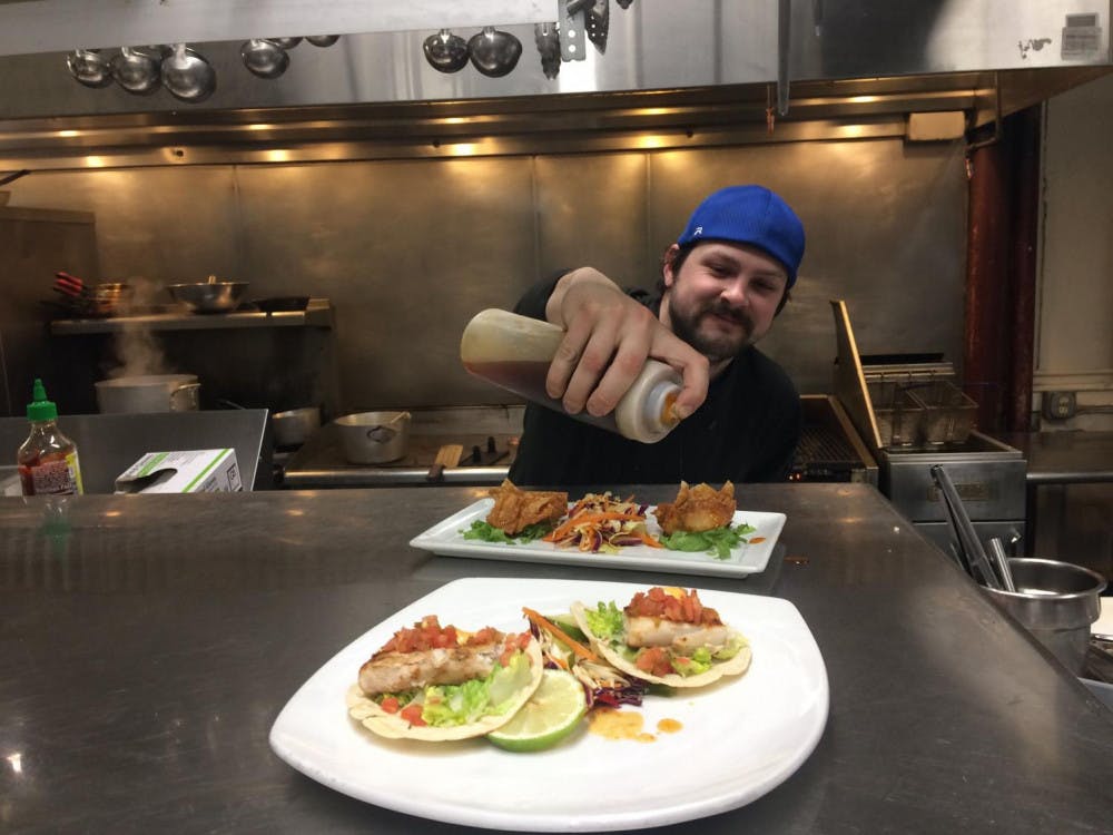 <span class="photocreditinline">Campus File Photo/ Taylor Phillips</span><br />Chef at Morgan’s Tavern at the Middlebury Inn prepares a dish.