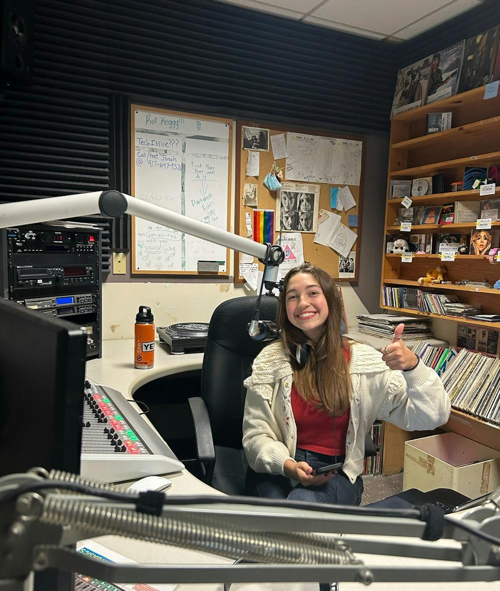 Georgia Millman Perlah ’25 sits at the soundboard in the studio.