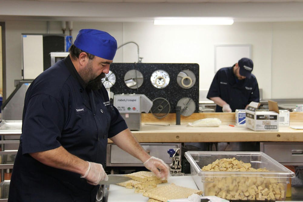 A staff member working in Proctor Dining Hall, which continues to face understaffing.
