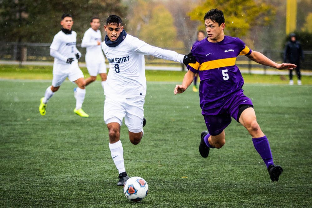 <span class="photocreditinline">MICHAEL BORENSTEIN/THE MIDDLEBURY CAMPUS</span><br />Fazl Shaikh ’20 aggressively goes for the ball against Williams on Saturday, Oct. 27. The men’s soccer team finished with a close loss but is hoping for a bid to the NCAA Tournament.