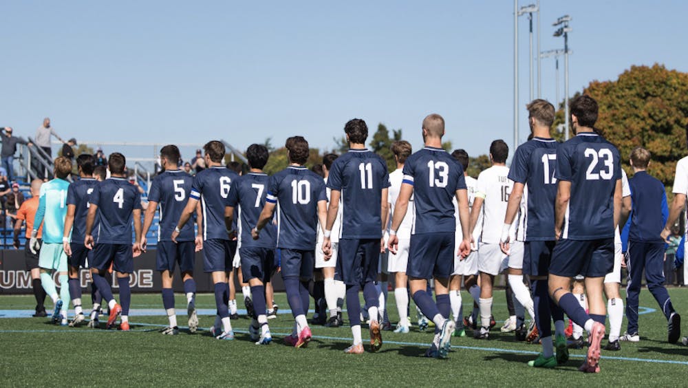 The men’s soccer team is introduced before their game against Tufts University.