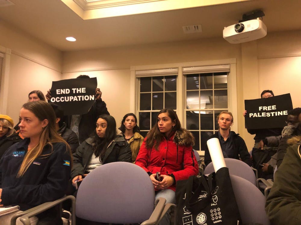 <span class="photocreditinline"><a href="https://middleburycampus.com/staff_profile/rain-ji/">RAIN JI</a></span><br />Students staged a silent protest during Khalid’s lecture to draw attention to human rights abuses in Palestine.