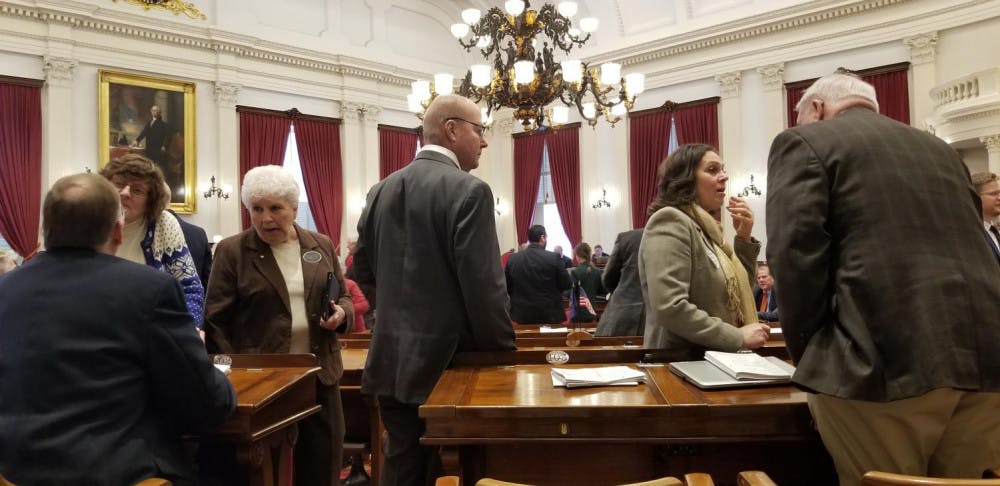 <span class="photocreditinline"><a href="https://middleburycampus.com/staff_profile/kaitlyn-girouard/">KAITLYN GIROUARD</a></span><br />Members of the House of Representatives discuss with each other before being called to order by the Speaker on February 6. There was unease before the floor session as Democrats were talking with legislators who voted to sustain the governor’s veto on paid family leave, asking for them to reconsider.