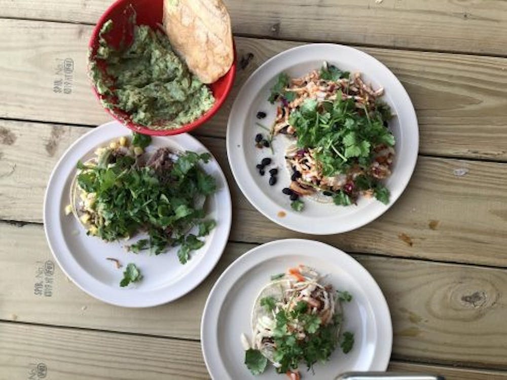<span class="photocreditinline">MELANIE CHOW</span><br />The Mad Taco’s menu in Middlebury includes a wide variety of tacos with generous helpings of cilantro.