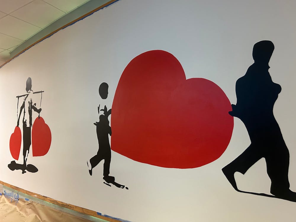 The new "Art Lords Mural" located in the entrance hallway towards Proctor Dining Hall.