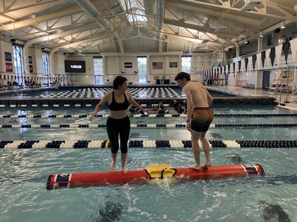 Log rollers Tyler Hadar ’25 and Hayden Laster ’25 showcase a logrolling duel. Photo Credit: Max Myers