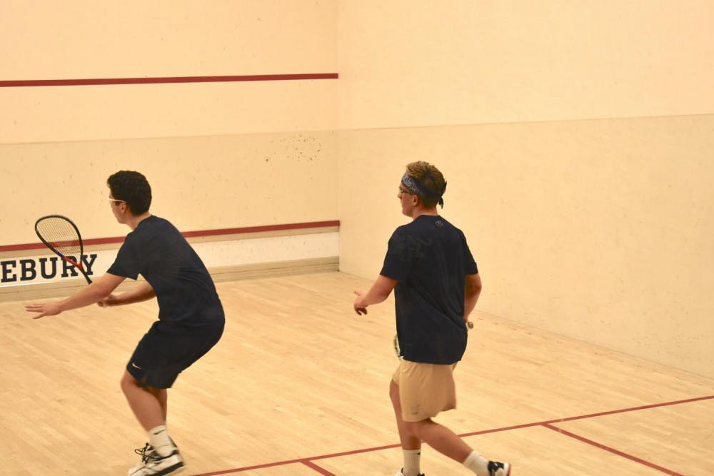 <span class="photocreditinline">MAX PADILLA</span><br />Wiatt Hinton ’21 (left) battles Navy’s Jamie Kjorlien (right) in the first men’s squash match of the season.