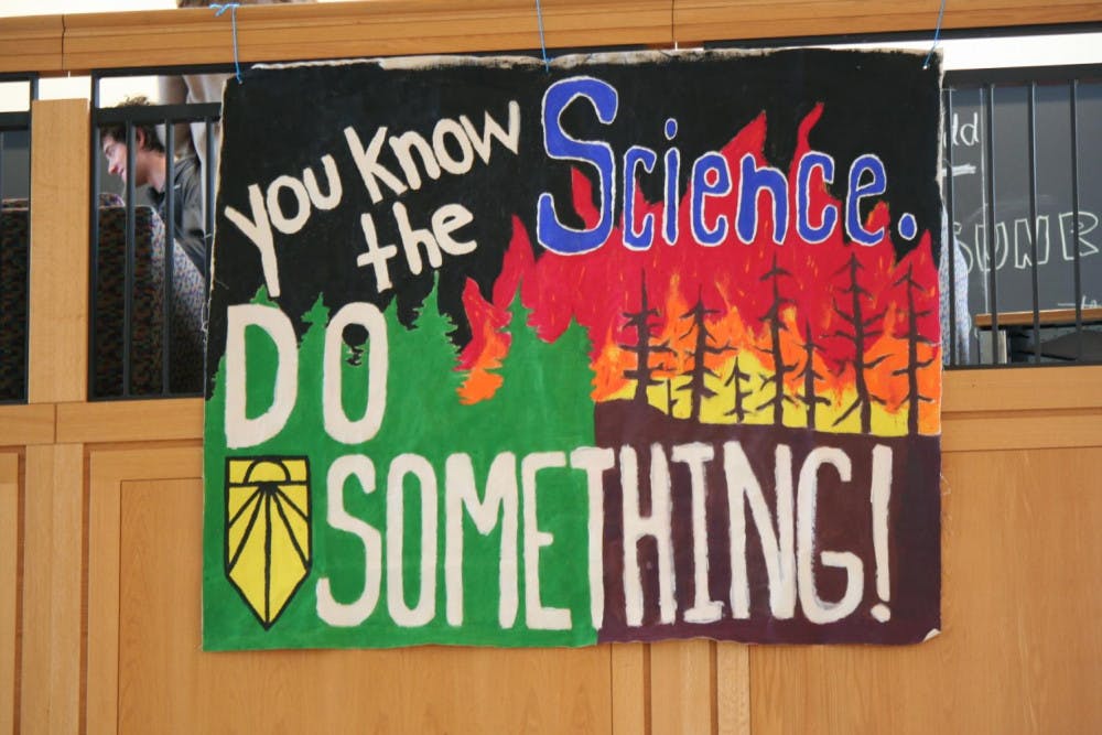<span class="photocreditinline">ERICA BISAILLON</span><br />A banner dropped in BiHall on December 6 by Sunrise Middlebury. The nation-wide youth movement advocates for action to combat climate change.