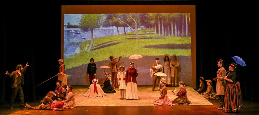 <span class="photocreditinline">COURTESY PHOTO</span><br />Performers are staged in a tableau of Georges Seurat’s “A Sunday Afternoon on the Island of La Grande Jatte.”
