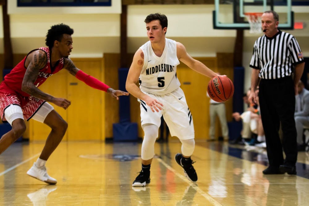 <span class="photocreditinline">MICHAEL BORENSTEIN/THE MIDDLEBURY CAMPUS</span><br />Max Bosco ’21 dribbles past a Keene State player on Saturday, Dec. 1.