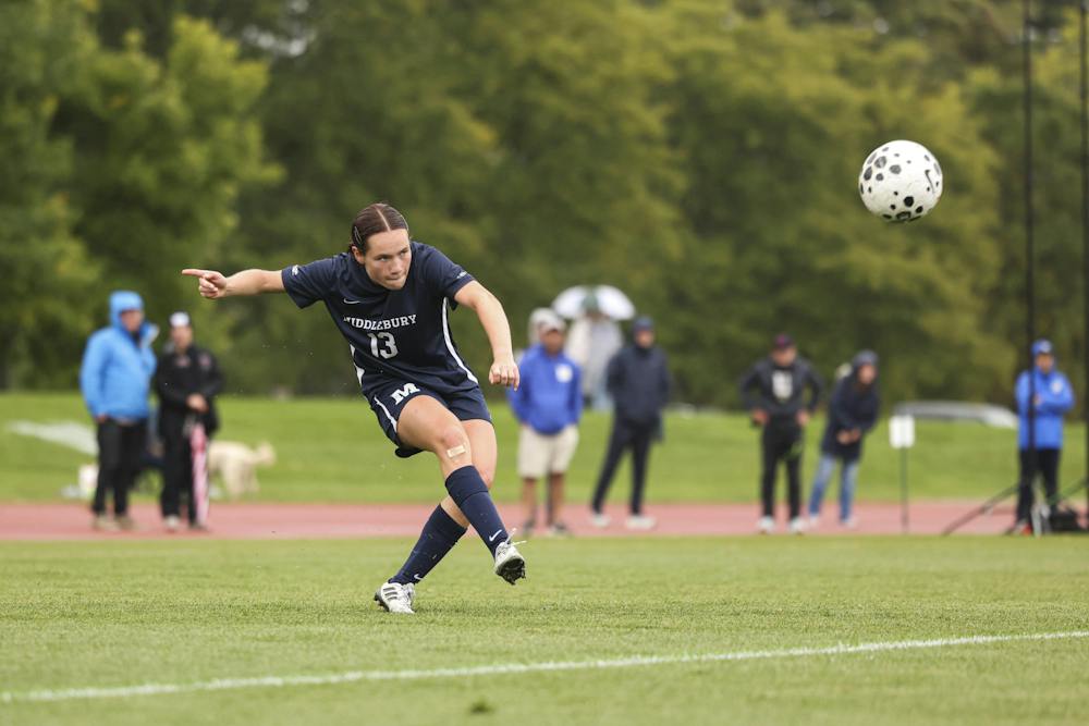 Fiona Linnau strikes a free kick with a determined look as Middlebury take on Hamilton.