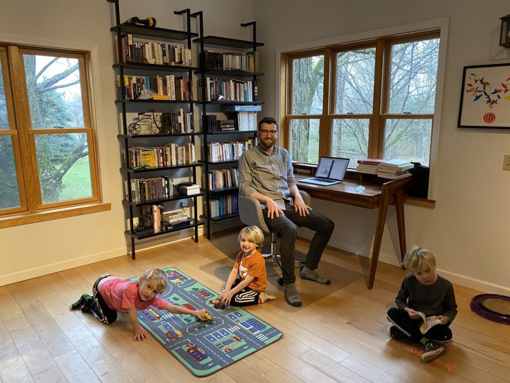 <span class="photocreditinline">COURTESY OF NICOLAS POPPE</span><br />Professor of Luso-Hispanic Studies Nicolas Poppe at home with his three young kids. Left to right: Lucas (4), Isaac (4) and Seba (6). Professor Poppe is currently undergoing tenure review, along with nine other faculty.