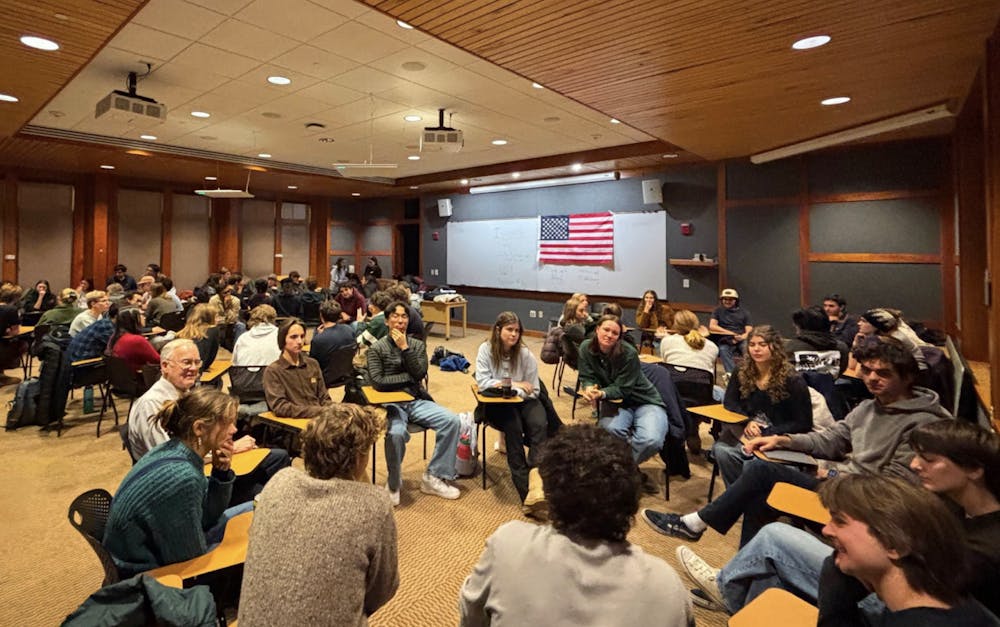 Students across the ideological spectrum and former Vermont Governor Jim Douglas discussing politics at the first College Republicans and College Democrats Joint Meeting on Nov. 17, 2025.

