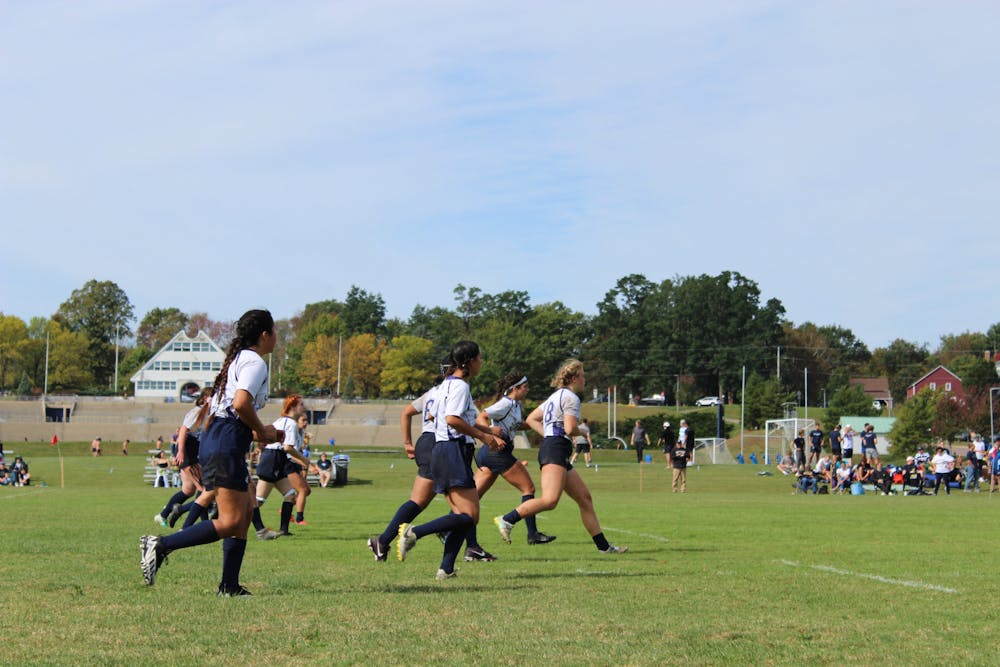 The women's rugby team plays against Bryant University.