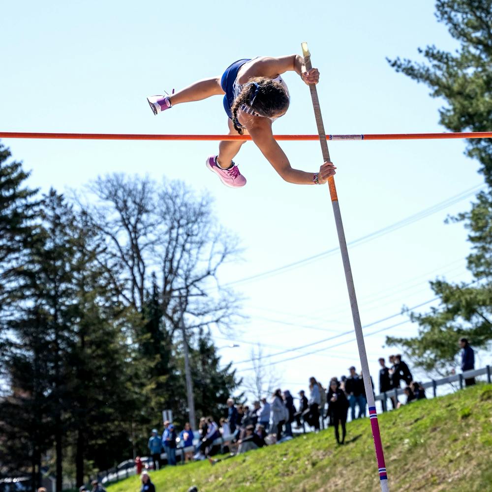 Jessica Warren ’25 flies through the air during the 2022 NESCAC Championships at Hamilton College.