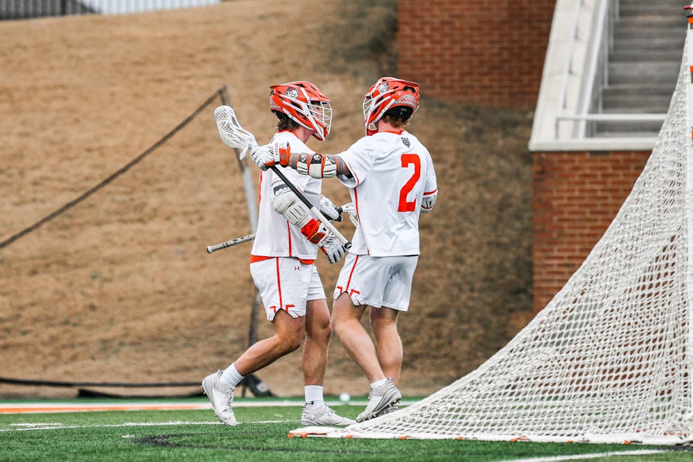 Dillon Bush '27 and Ganon Cope '28 congratulate each other during a win against Hampton University on Jan. 31. 